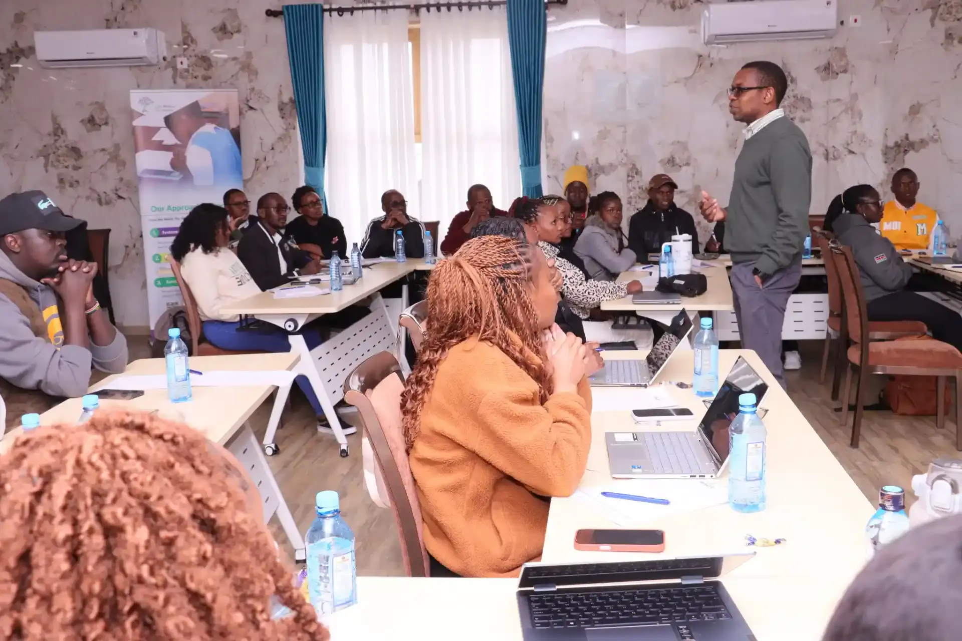 Community meeting discussing education initiatives