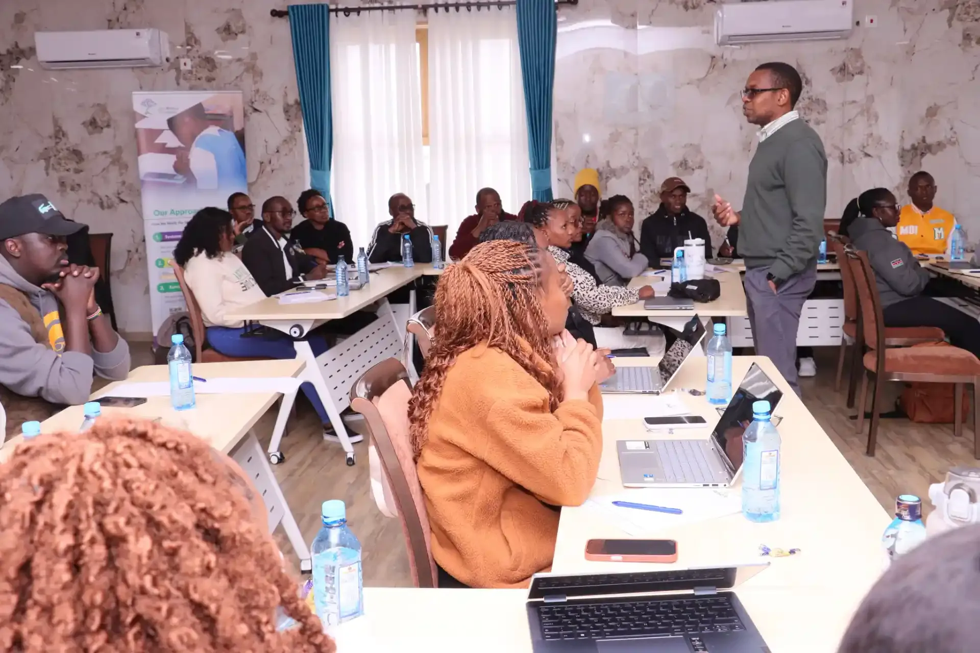 Community meeting discussing education initiatives